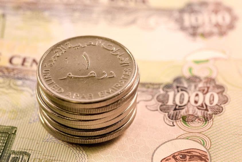 यूएई मुद्रा: 1000 दिरहम का बिल और 1 दिरहम सिक्का।