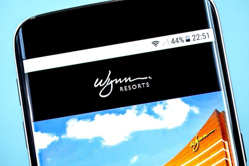 स्मार्टफोन स्क्रीन पर प्रदर्शित Wynn Resorts लोगो।